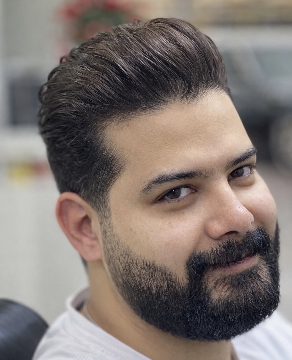 Styled hair and sculpted beard close-up